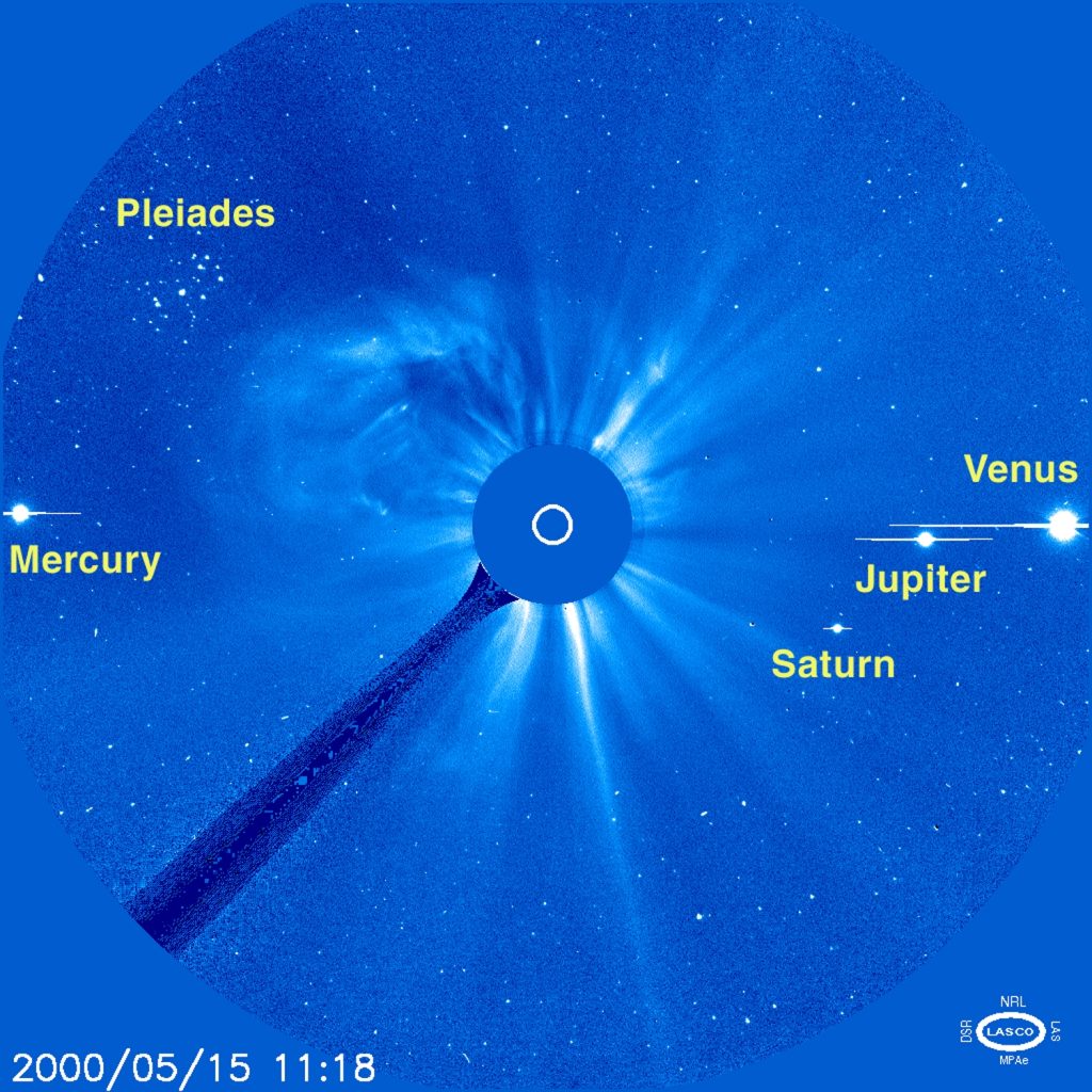A blue circle with flares of white emitting from it.